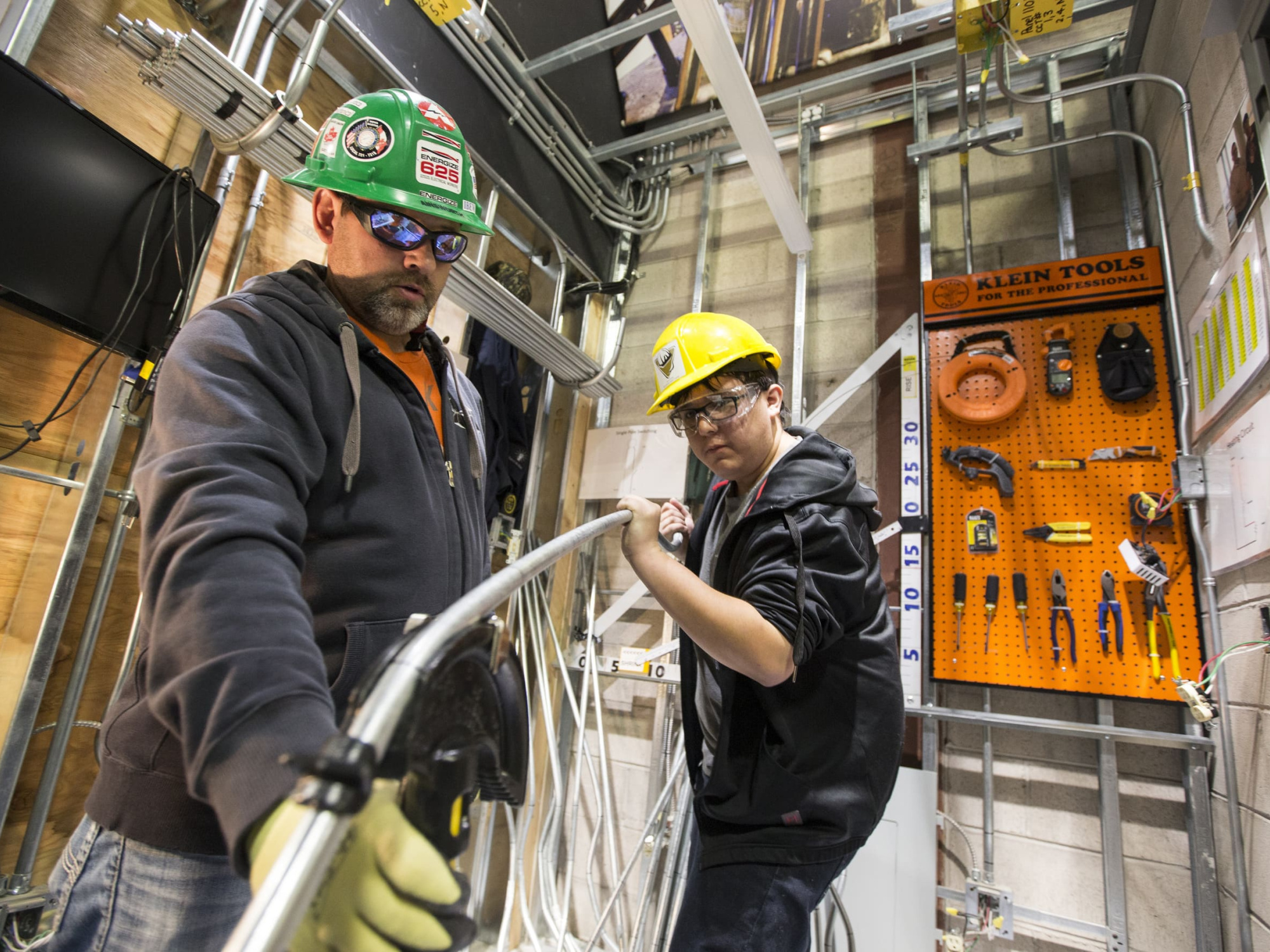 A journey-person and an apprentice working together