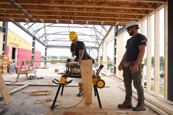 Carpenter working on house